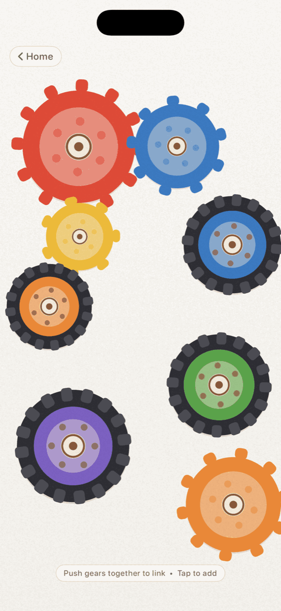 Gears & Tires in Twirlio: bright red, blue and yellow cogs meshed together at the top of the screen, with tractor tires and a loose orange cog scattered below.